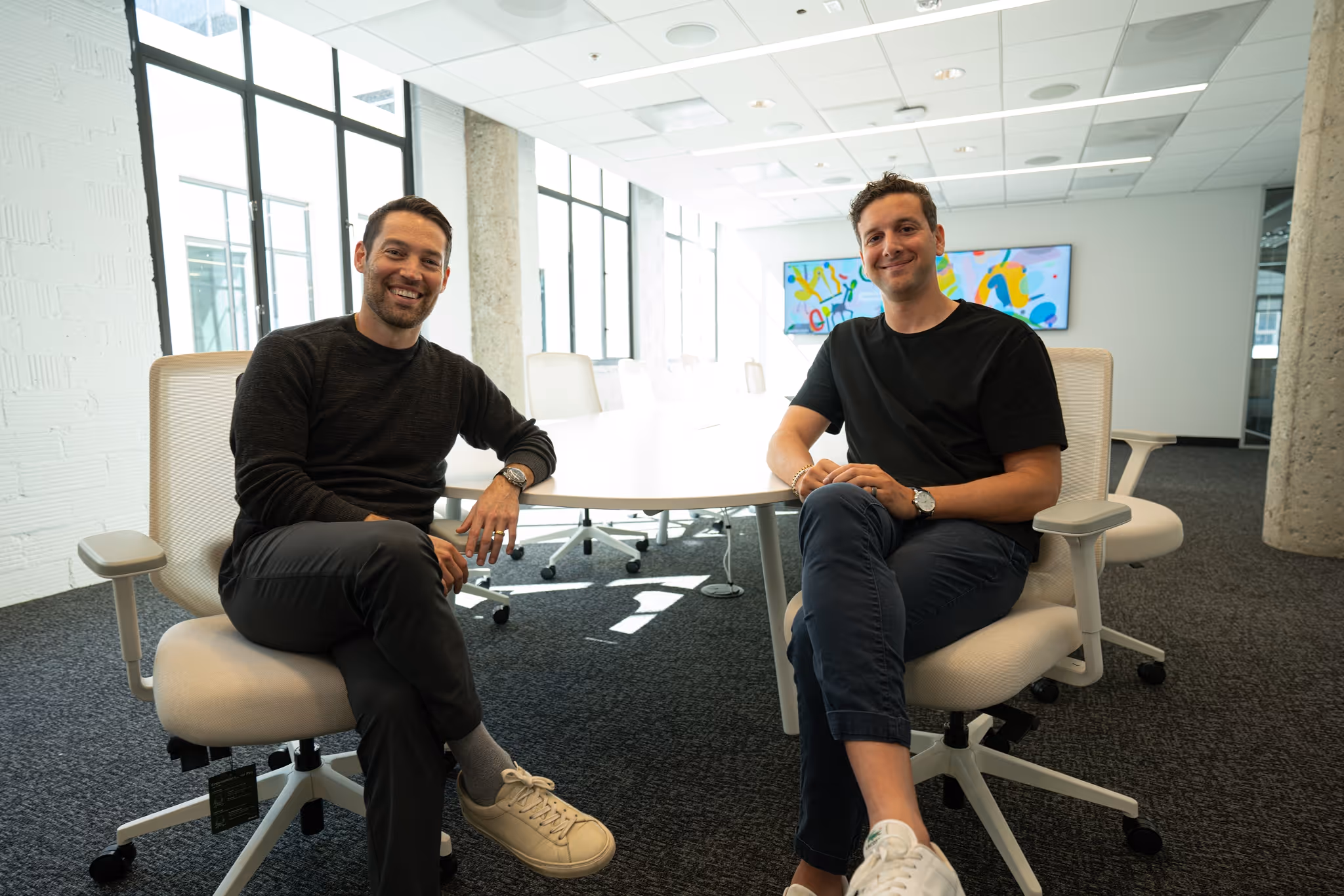 Two Shepherd co-founders seated together in the office.
